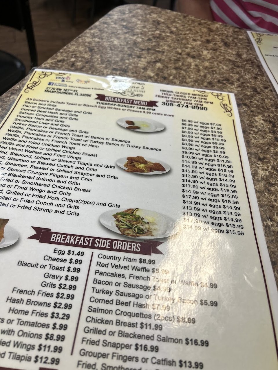 Printed menu with shrimp and fish dishes.